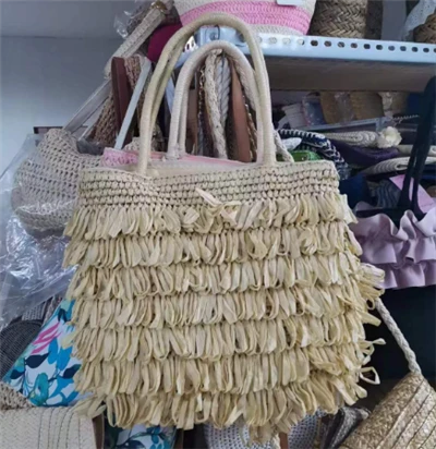Tassels minsuġa bl-idejn borża tat-tiben